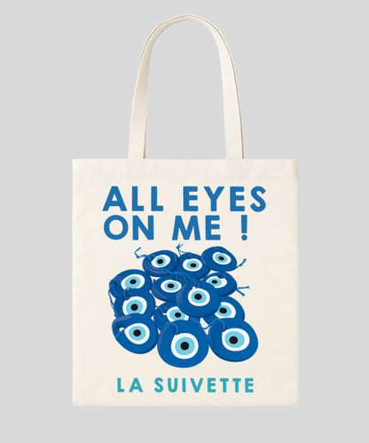 Tot bag en coton blanc "All Eyes On Me" avec motif d'yeux bleus Nazar Boncuk pour la protection contre le mauvais œil (La Suivette).